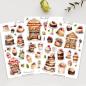 Preview: Set von drei Stickerbögen mit handgezeichneten Motiven von Kuchen, Cupcakes und Dessertvitrinen im Vintage-Stil. Jedes Motiv ist liebevoll gestaltet mit reich verzierten Torten, Cupcakes und Süßspeisen, die farbenfrohe Blumen und Beeren zeigen. Ein perfek
